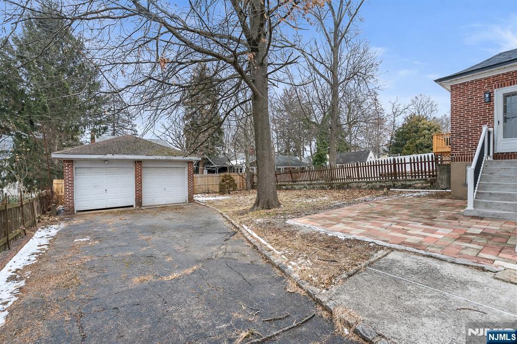 33 Robertson Road West Orange, NJ 07052 - Photo 41 of 48 a front view of a house with a yard and garage