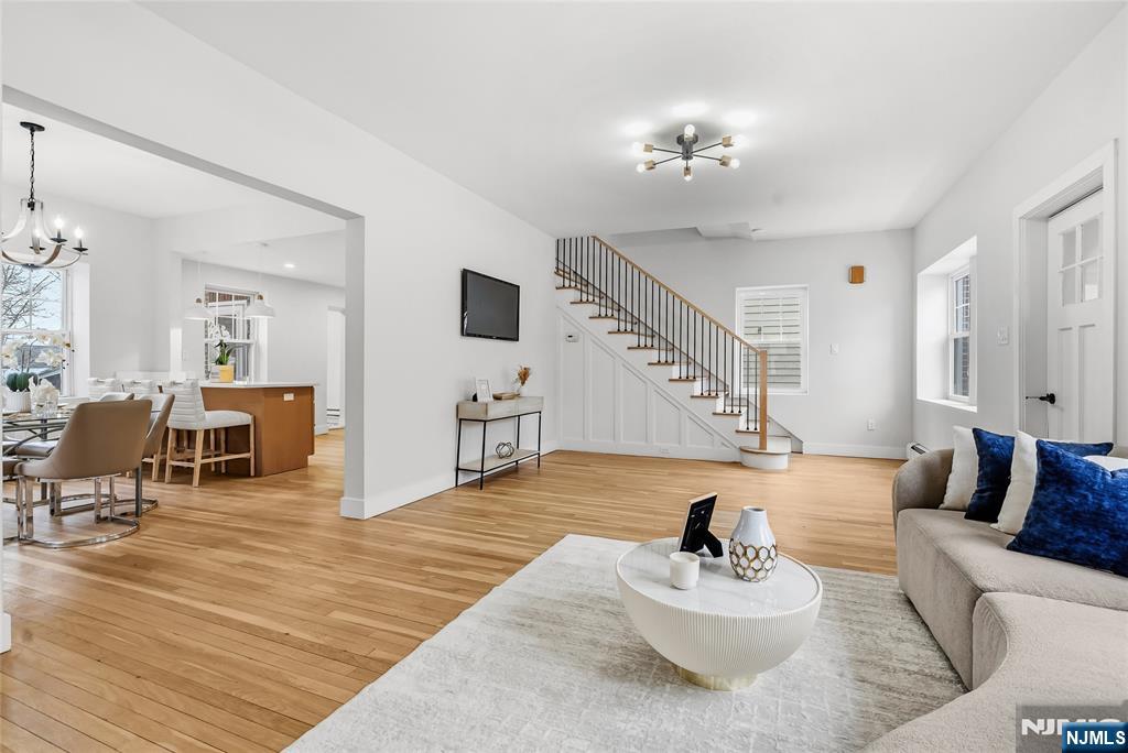 33 Robertson Road West Orange, NJ 07052 - Photo 7 of 48 a living room with furniture and wooden floor