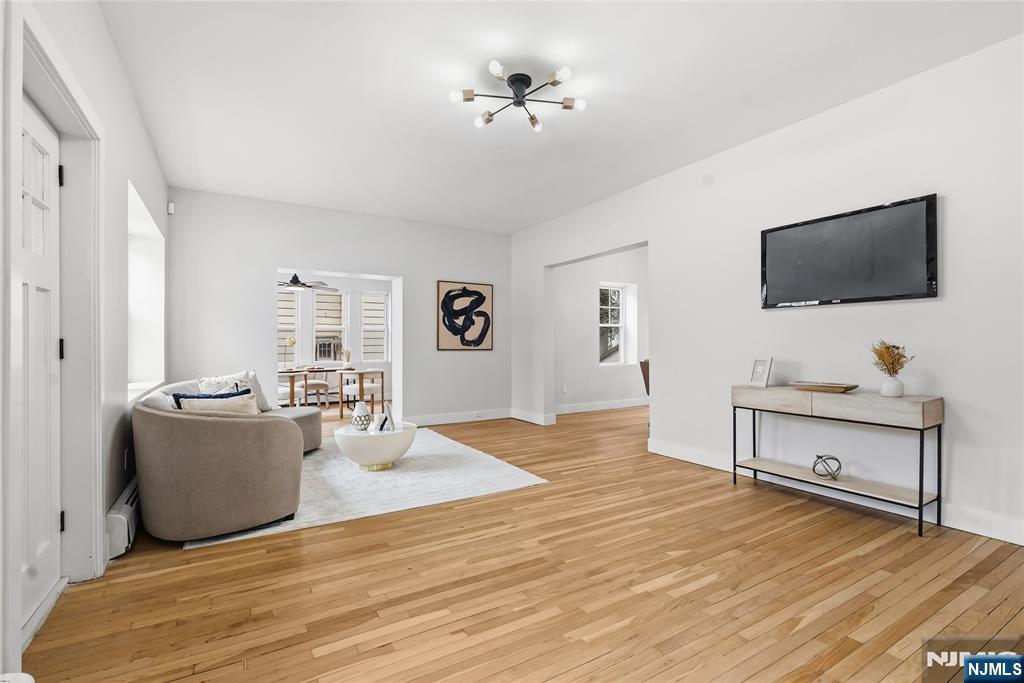 33 Robertson Road West Orange, NJ 07052 - Photo 8 of 48 a living room with furniture and a flat screen tv
