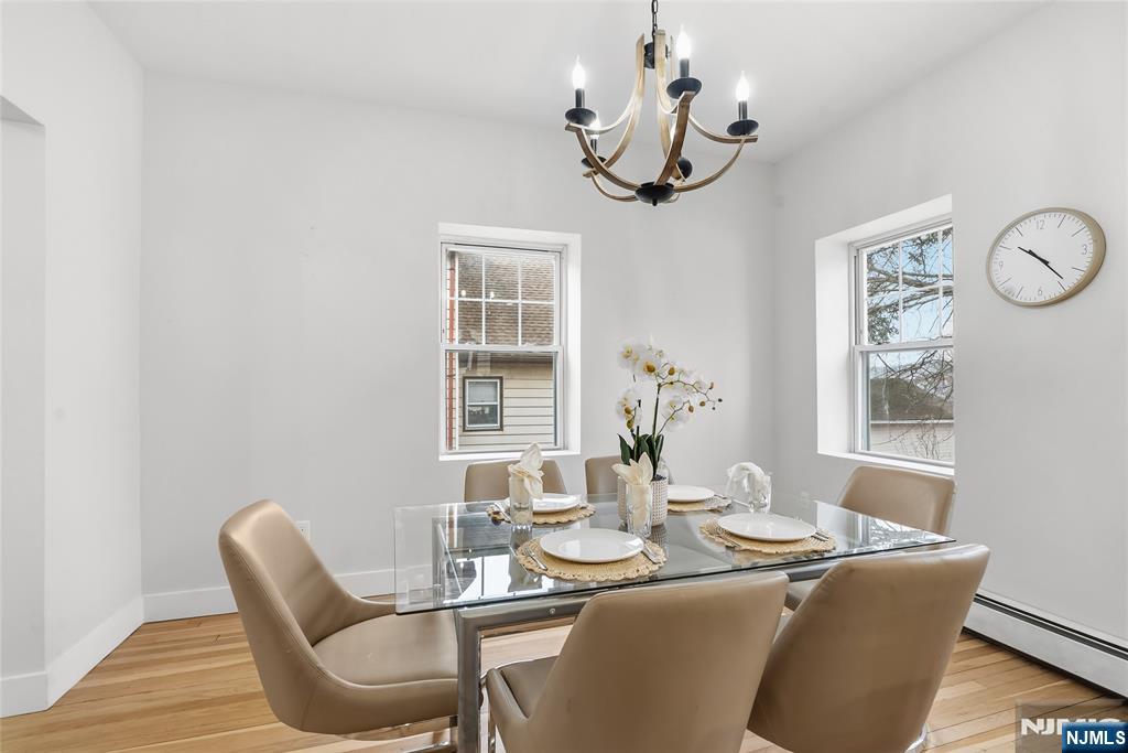33 Robertson Road West Orange, NJ 07052 - Photo 10 of 48 a dining room with furniture a chandelier and window