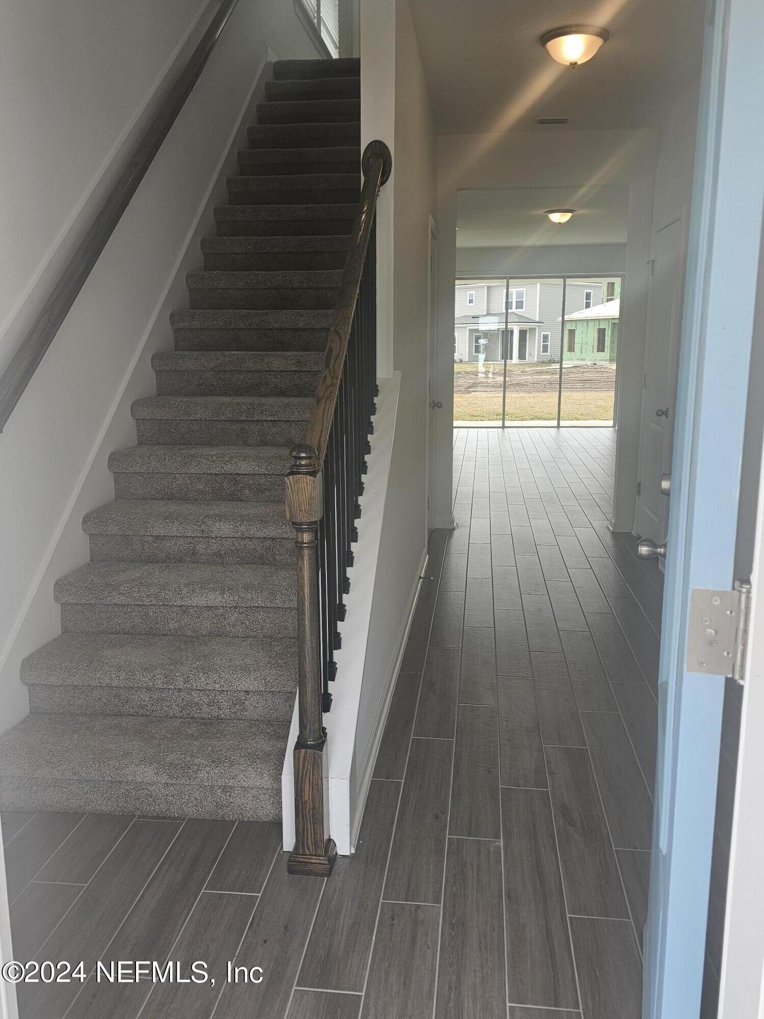 183 Bluegrass Way St. Augustine, FL 32092 - Photo 2 of 9 a view of entryway with wooden floor