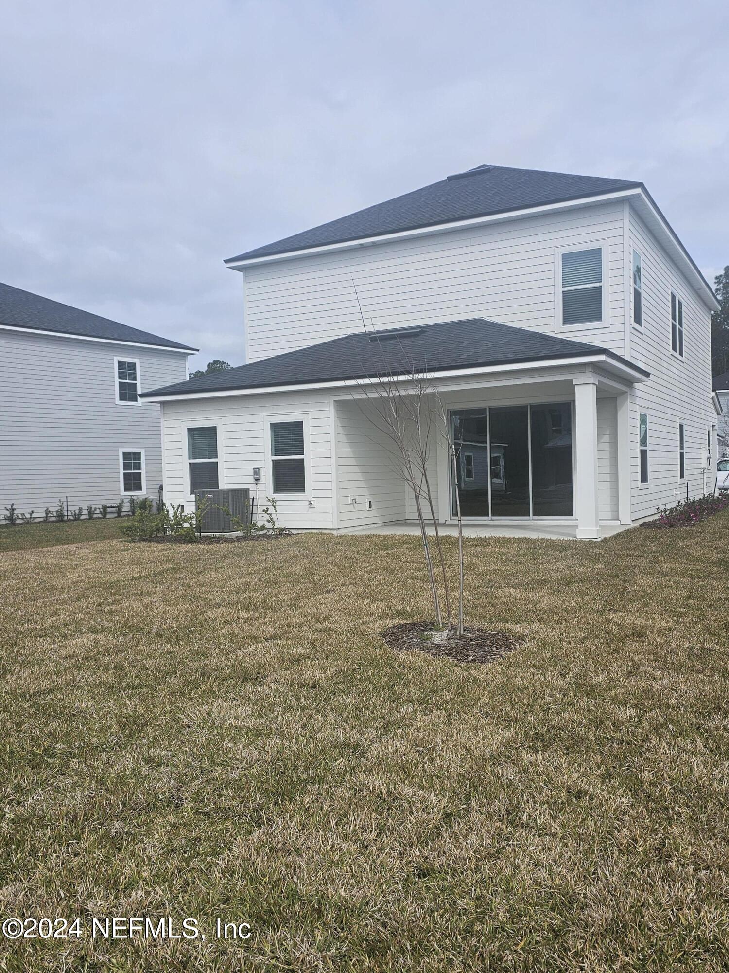 183 Bluegrass Way St. Augustine, FL 32092 - Photo 7 of 9 a house that has a lot of windows in it