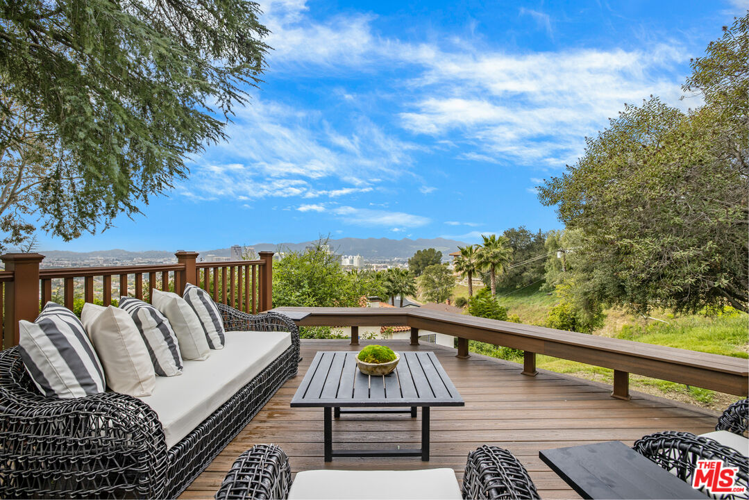861 Cavanagh Road Glendale, CA 91207 - Photo 17 of 21 a view of a balcony with wooden floor and outdoor seating