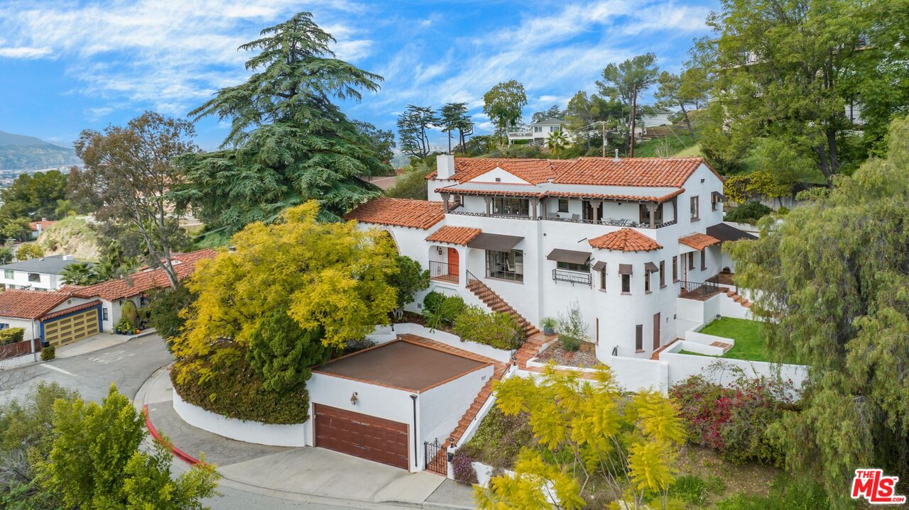 861 Cavanagh Road Glendale, CA 91207 - Photo 2 of 21 a view of a house with a yard and potted plants