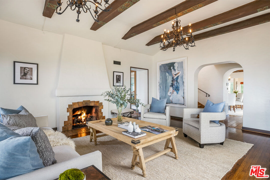 861 Cavanagh Road Glendale, CA 91207 - Photo 4 of 21 a living room with fireplace furniture and a chandelier