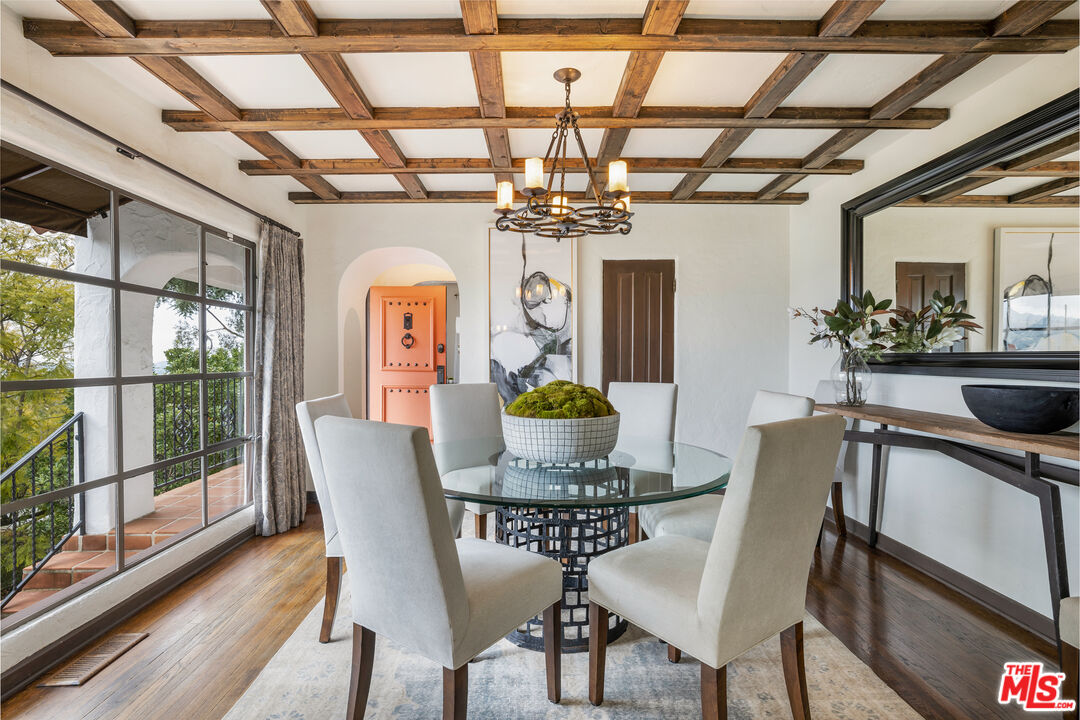 861 Cavanagh Road Glendale, CA 91207 - Photo 5 of 21 a view of a dining room with furniture a chandelier and wooden floor