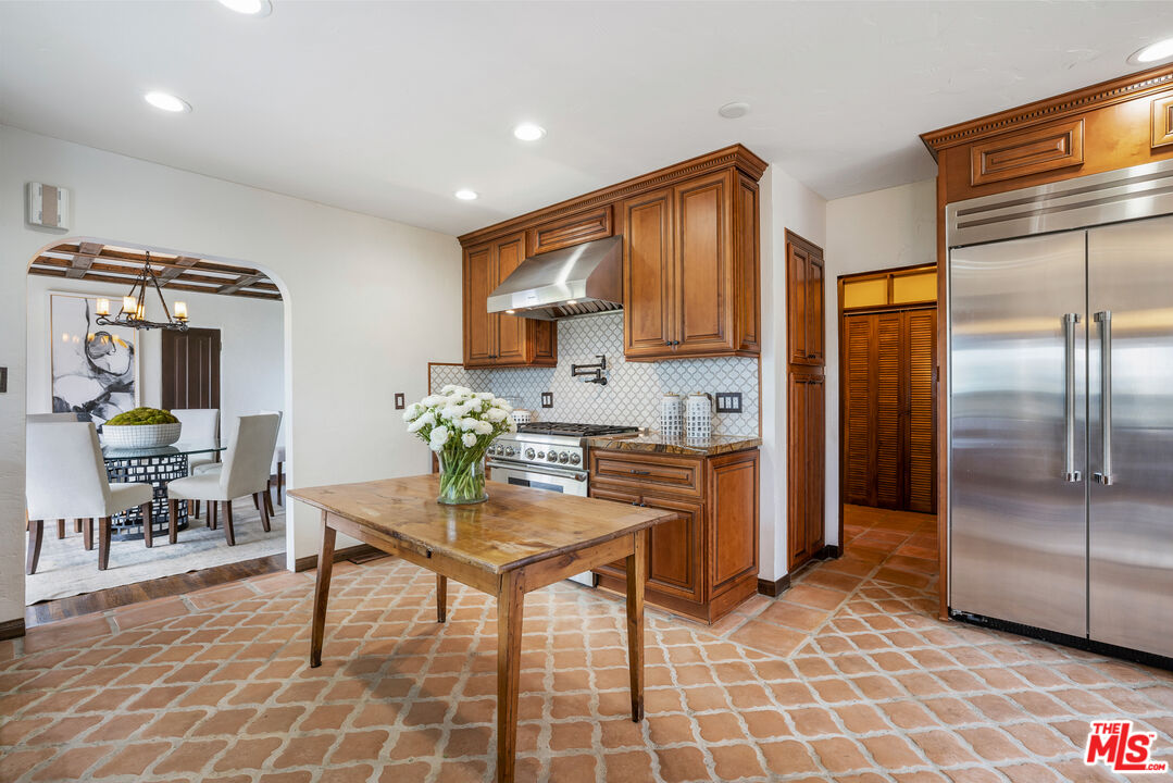 861 Cavanagh Road Glendale, CA 91207 - Photo 6 of 21 a kitchen with stainless steel appliances granite countertop a refrigerator and a stove top oven