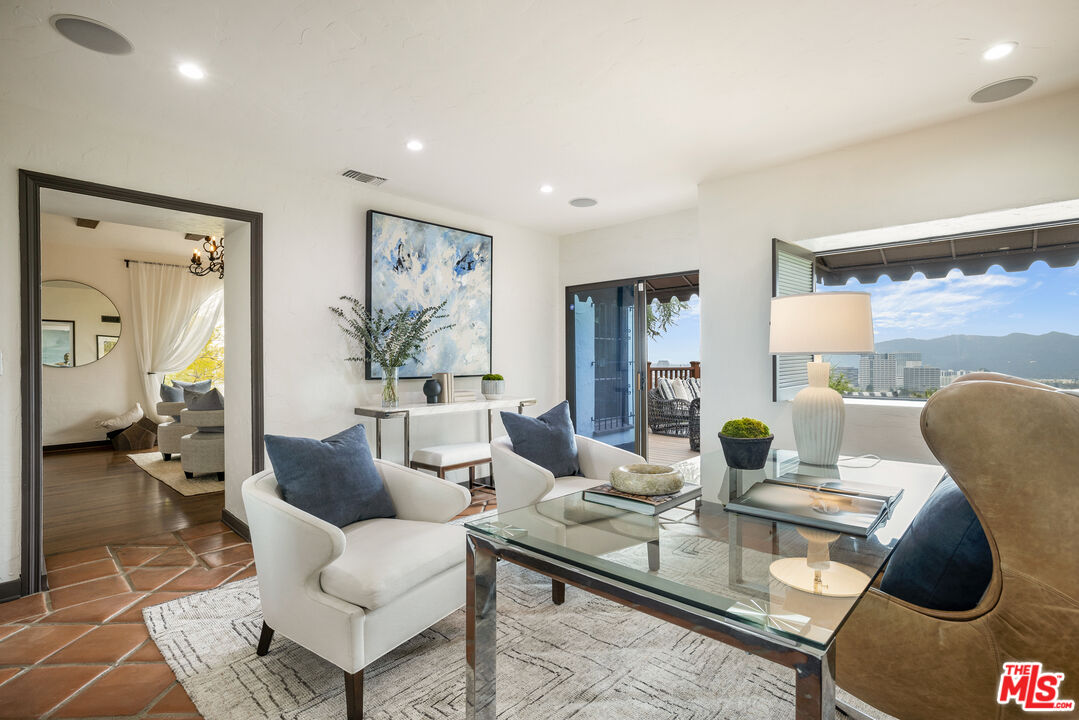 861 Cavanagh Road Glendale, CA 91207 - Photo 8 of 21 a living room with furniture and a large window