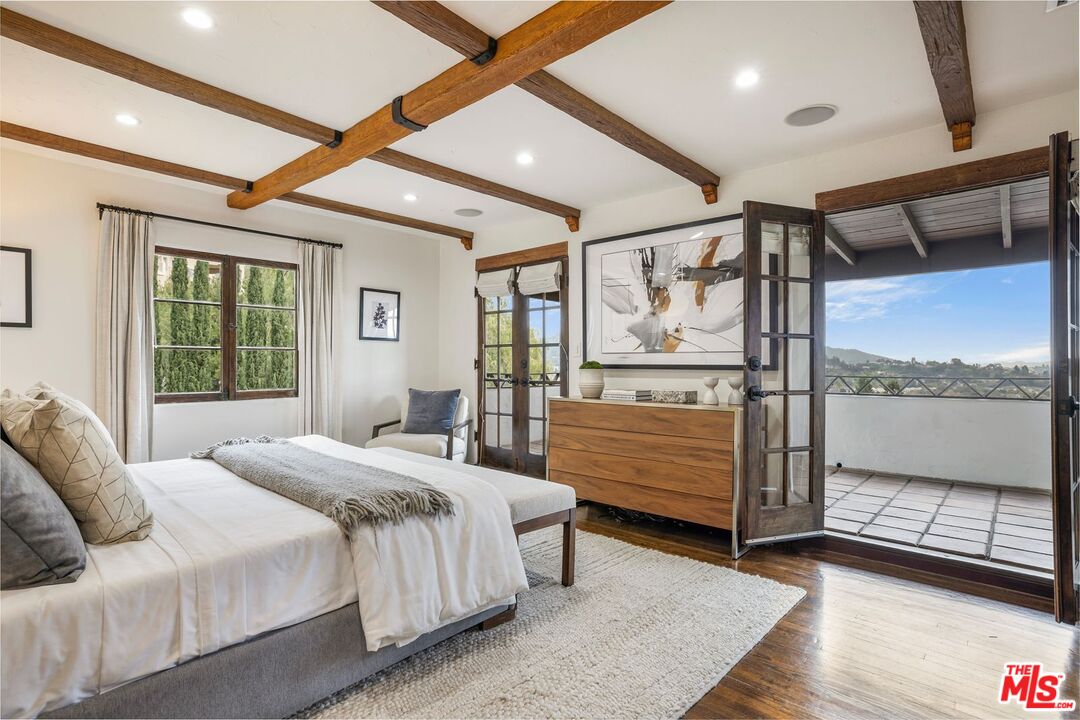 861 Cavanagh Road Glendale, CA 91207 - Photo 10 of 21 a bedroom with a large bed and large window