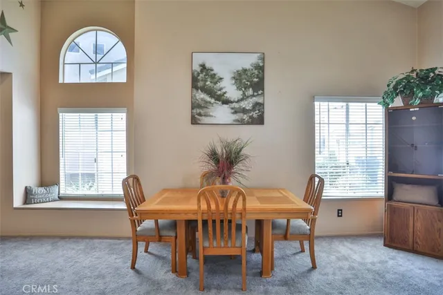 a swimming pool with outdoor seating and yard