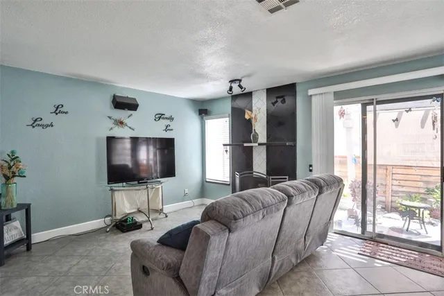 a view of a livingroom with furniture and windows