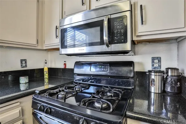 a bathroom with a toilet sink and shower