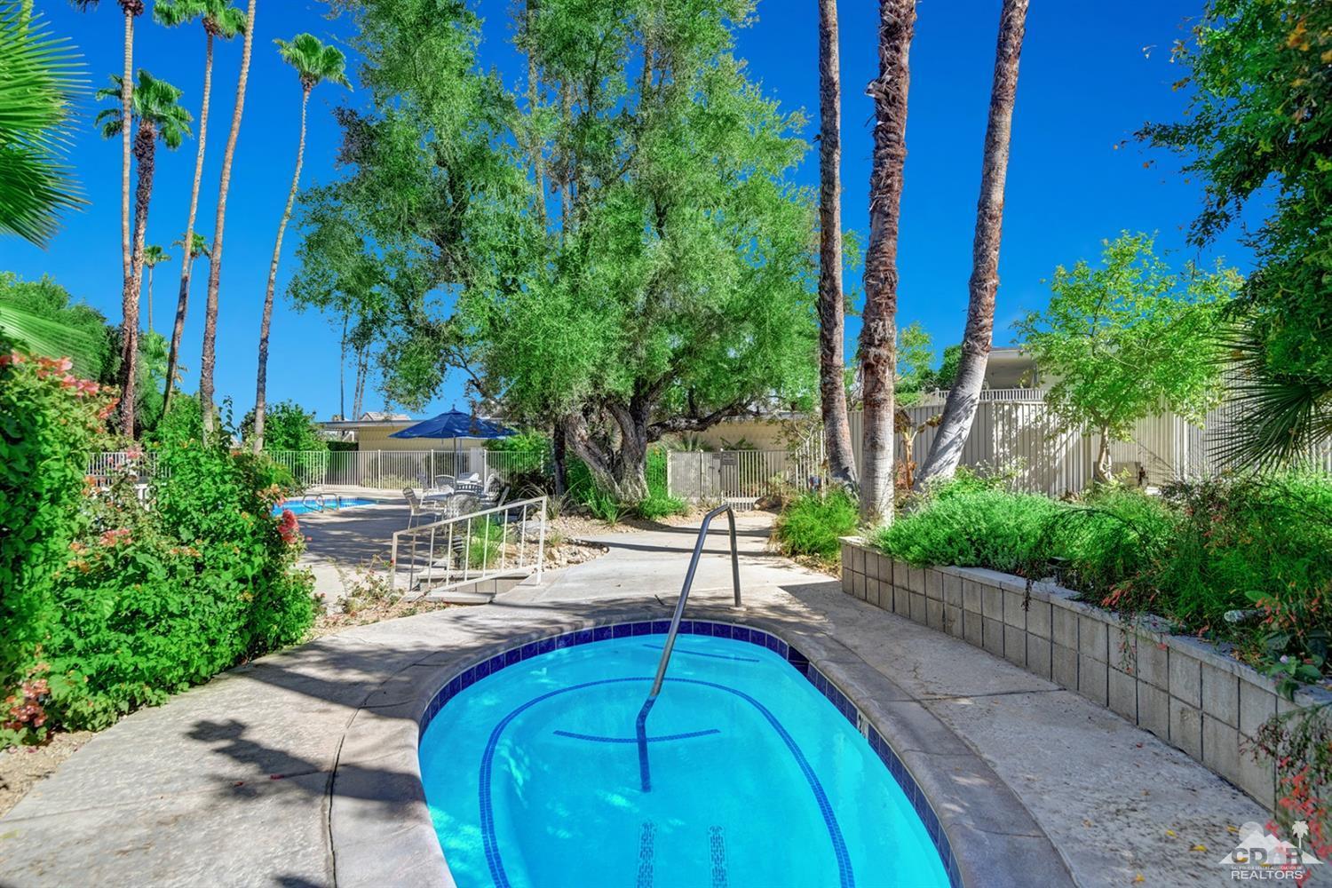 42278 Dunes View Road, Unit 27 Rancho Mirage, CA 92270 - Photo 19 of 20 a view of a backyard with plants and outdoor seating