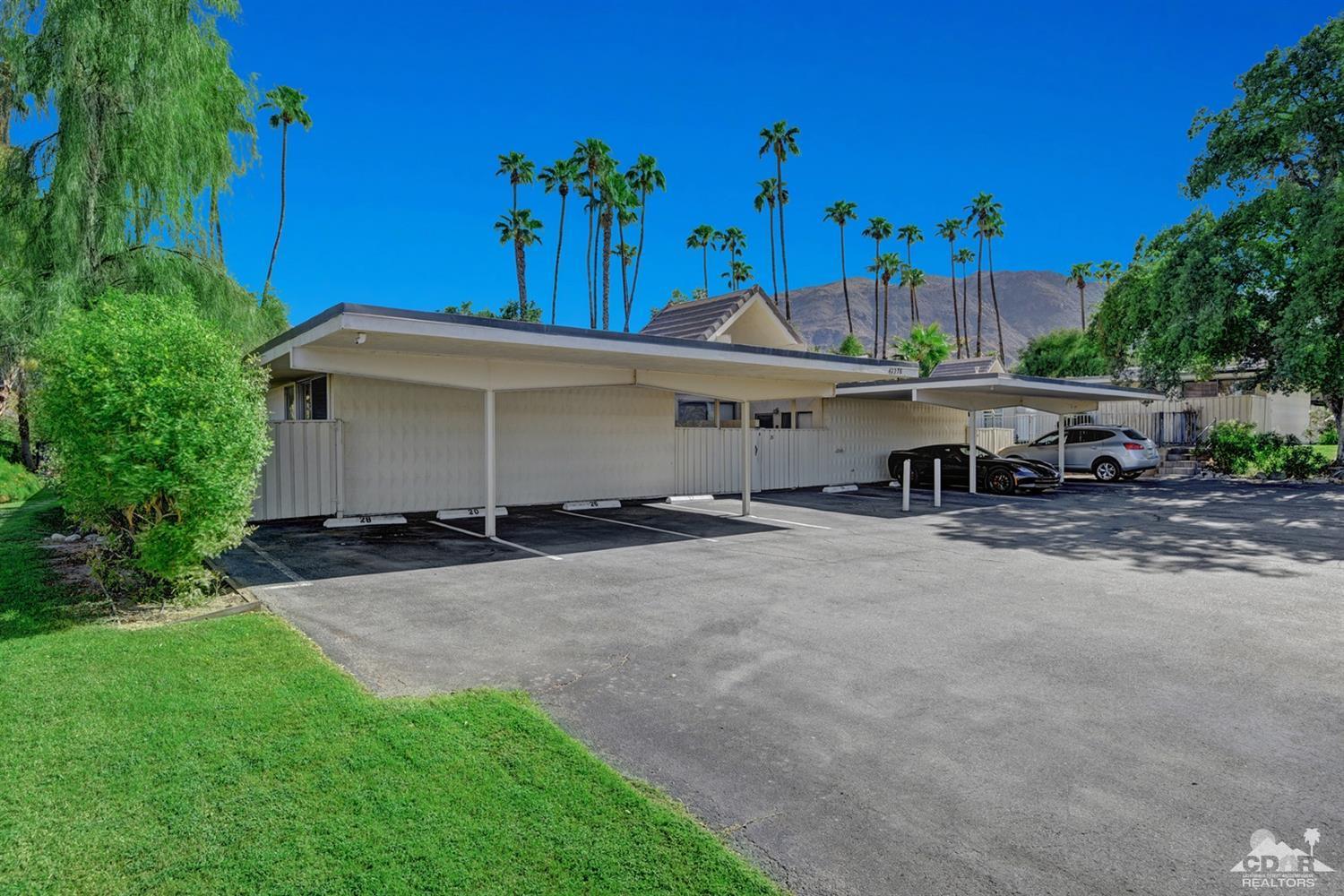 42278 Dunes View Road, Unit 27 Rancho Mirage, CA 92270 - Photo 20 of 20 a view of a house with a yard and tree