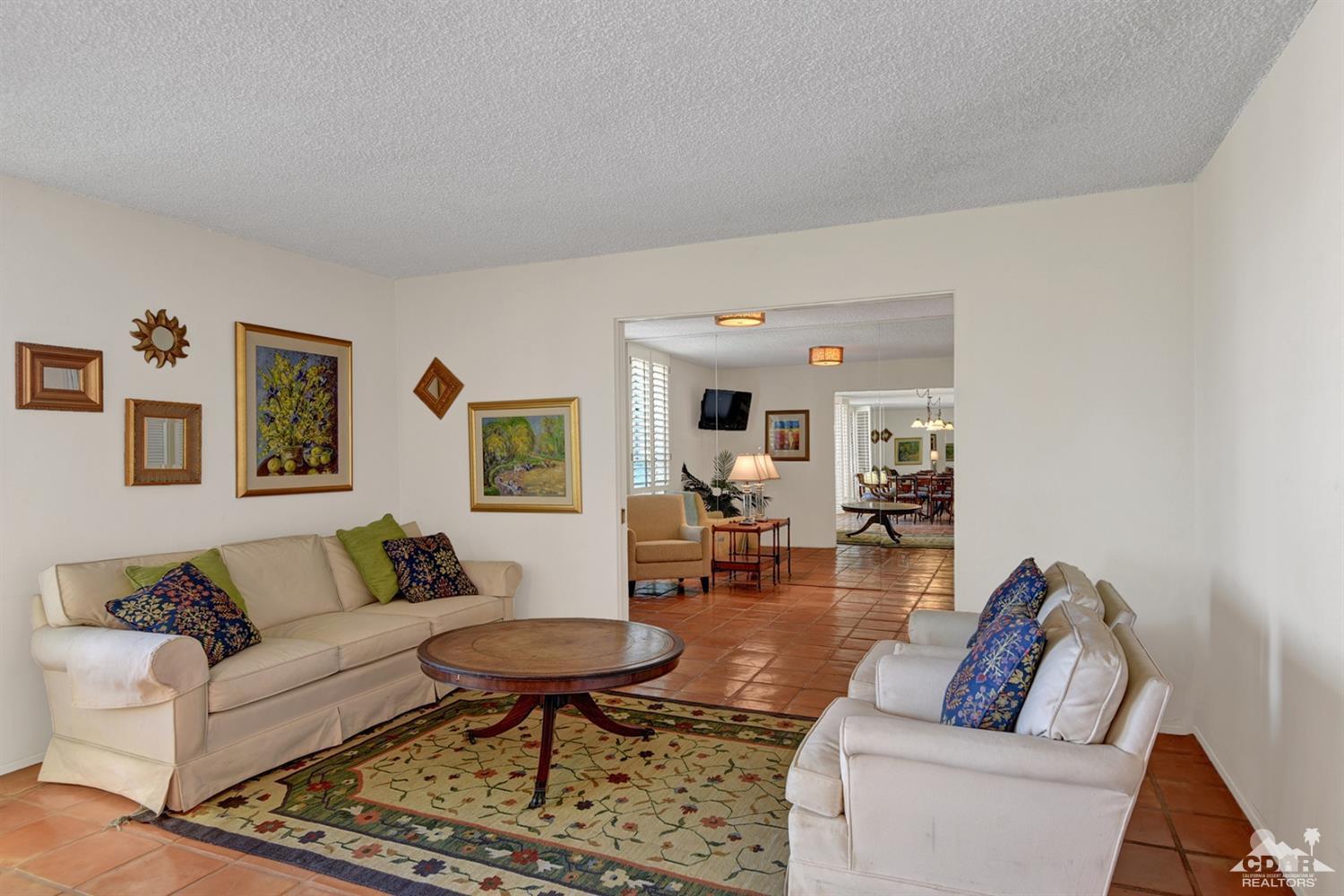 42278 Dunes View Road, Unit 27 Rancho Mirage, CA 92270 - Photo 4 of 20 a living room with furniture and a couch
