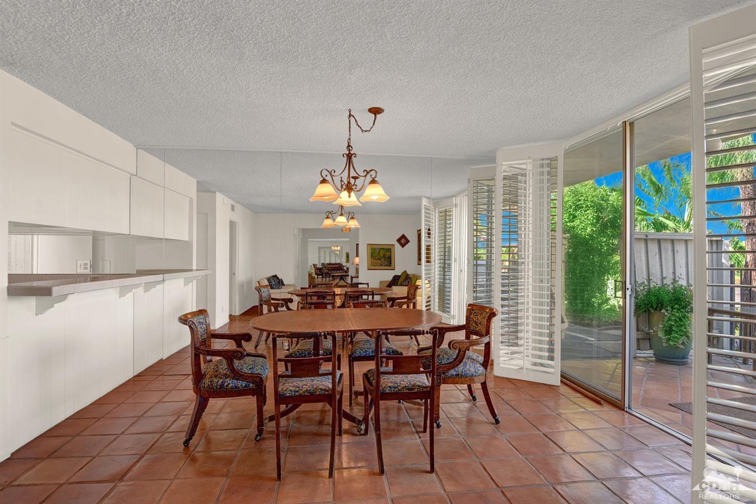 42278 Dunes View Road, Unit 27 Rancho Mirage, CA 92270 - Photo 8 of 20 a view of a dining room with furniture window and outside view