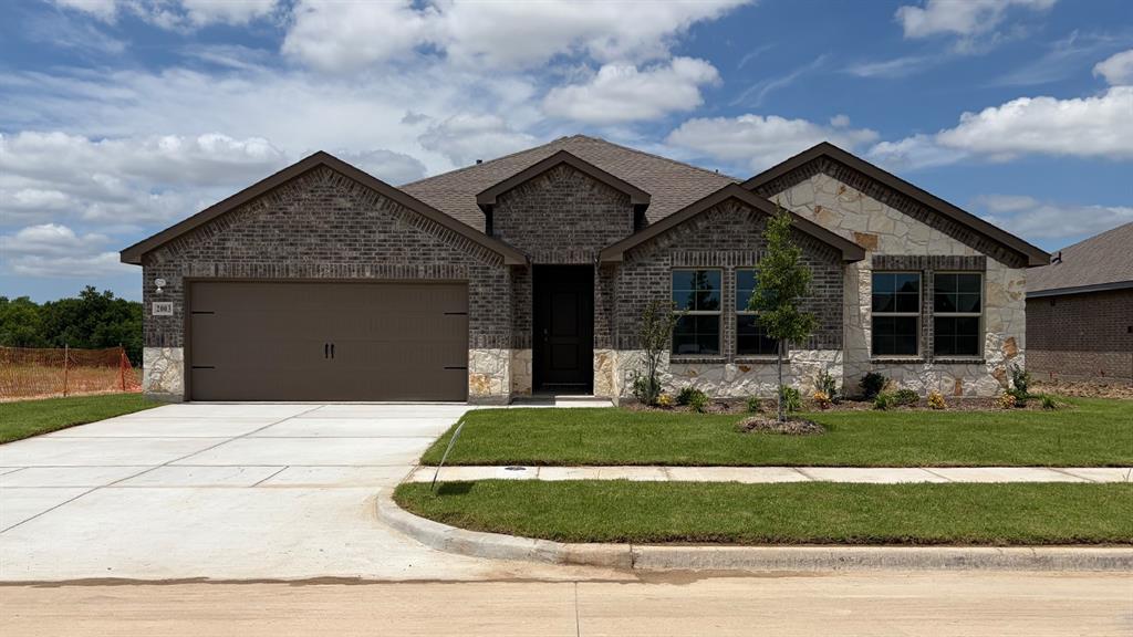 2003 Reveille Way Terrell, TX 75160 - Photo 1 of 25 Single-story residence featuring a combination of brick and stone facade