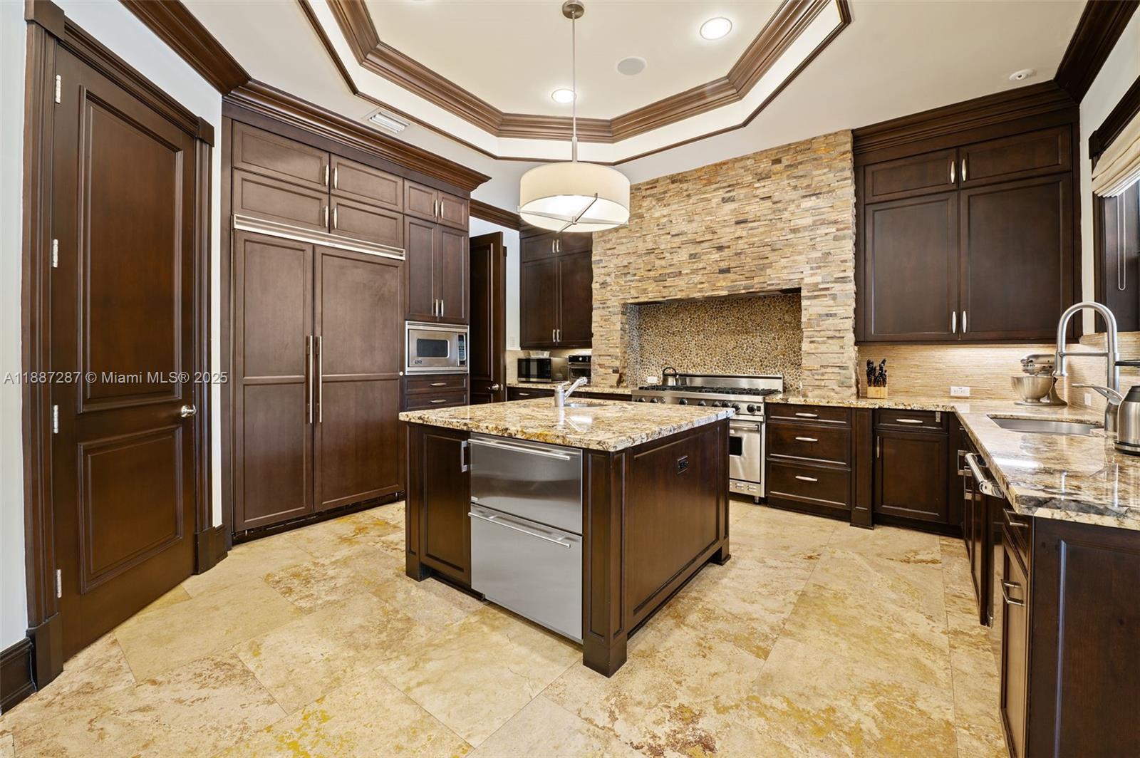 9601 Southwest 60th Court Pinecrest, FL 33156 - Photo 12 of 61 a kitchen with stainless steel appliances granite countertop a sink stove and refrigerator