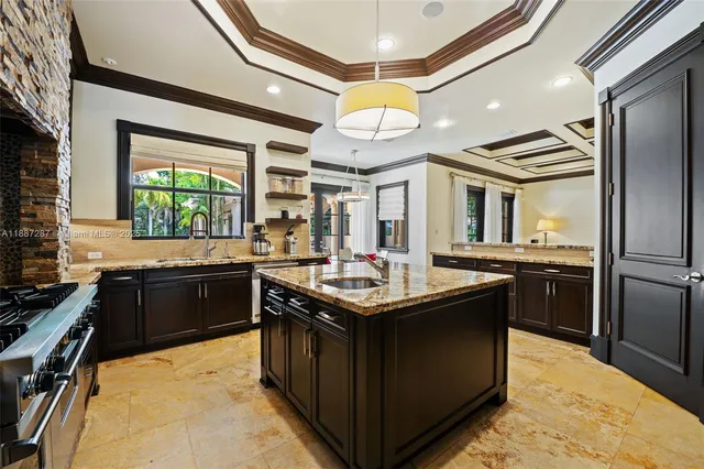 a kitchen with a sink and cabinets