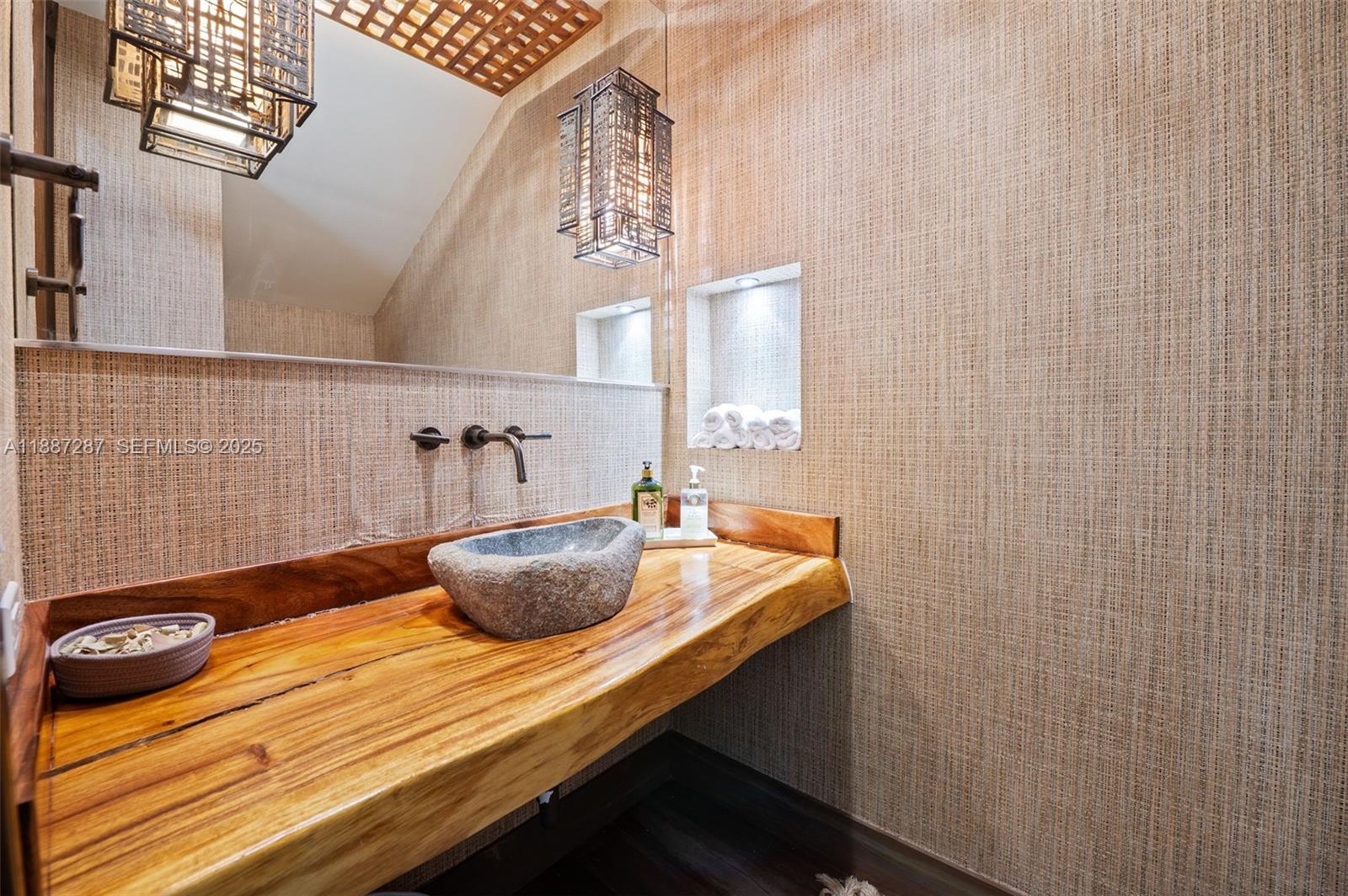 9601 Southwest 60th Court Pinecrest, FL 33156 - Photo 20 of 61 a bathroom with a granite countertop sink and a mirror