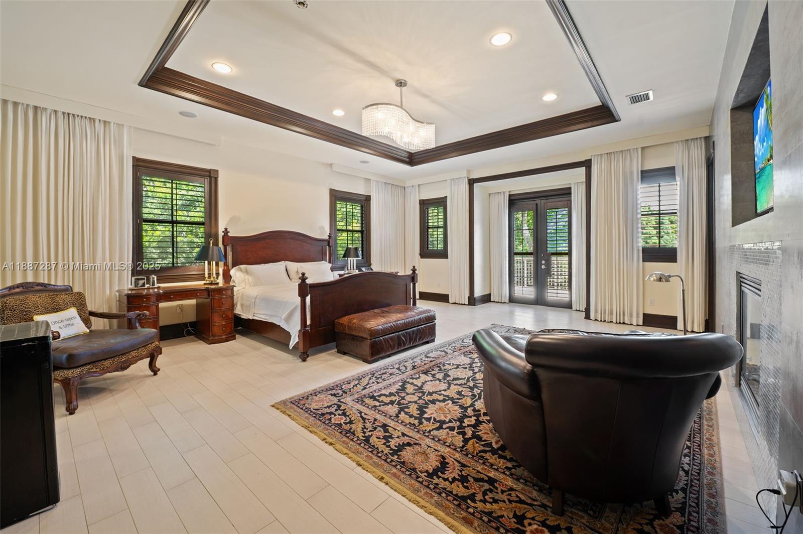 9601 Southwest 60th Court Pinecrest, FL 33156 - Photo 23 of 61 a living room with furniture and a large window