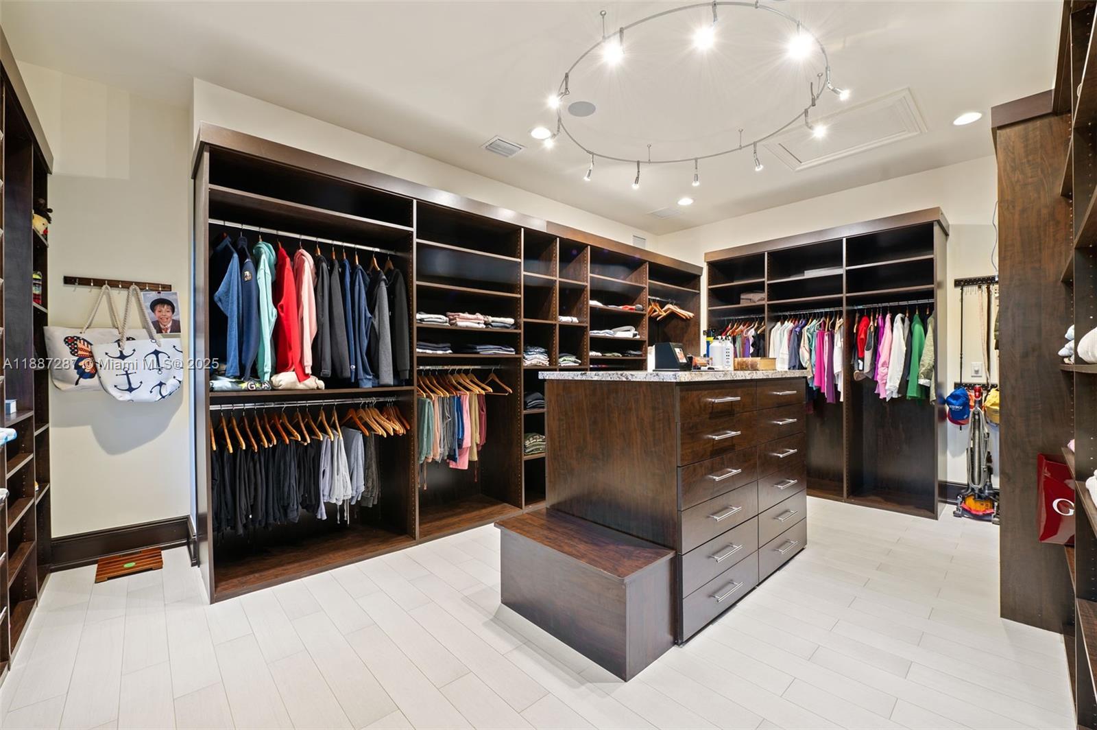 9601 Southwest 60th Court Pinecrest, FL 33156 - Photo 25 of 61 a living room with lots of furniture and closet