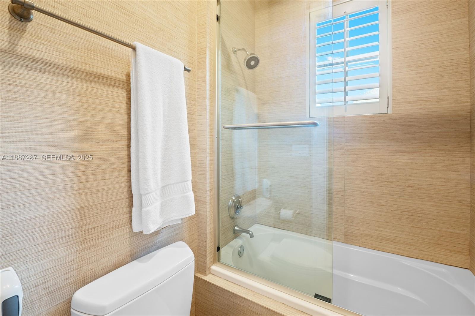 9601 Southwest 60th Court Pinecrest, FL 33156 - Photo 34 of 61 a bathroom with a bathtub and a shower