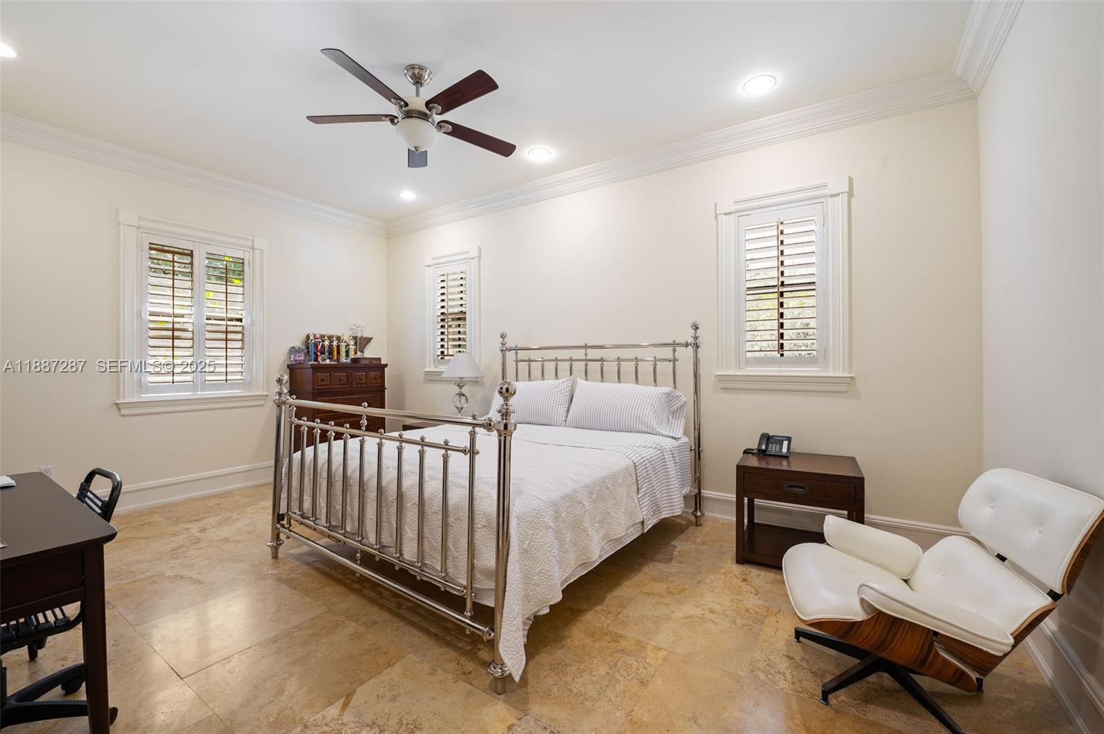 9601 Southwest 60th Court Pinecrest, FL 33156 - Photo 39 of 61 a bed room with a bed and a couch