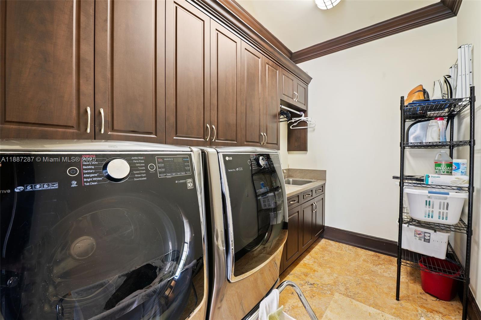 9601 Southwest 60th Court Pinecrest, FL 33156 - Photo 41 of 61 a view of a storage & utility room with washer and dryer