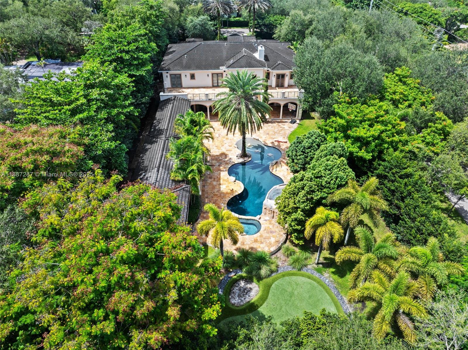 9601 Southwest 60th Court Pinecrest, FL 33156 - Photo 59 of 61 an aerial view of a house with a garden