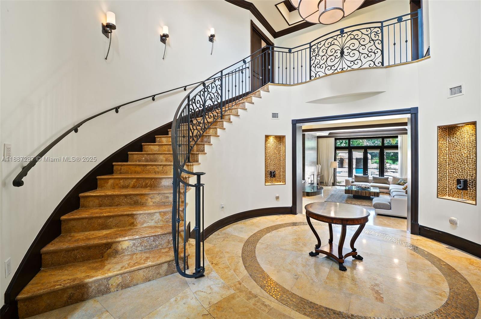 9601 Southwest 60th Court Pinecrest, FL 33156 - Photo 6 of 61 a view of entryway and dining room with furniture