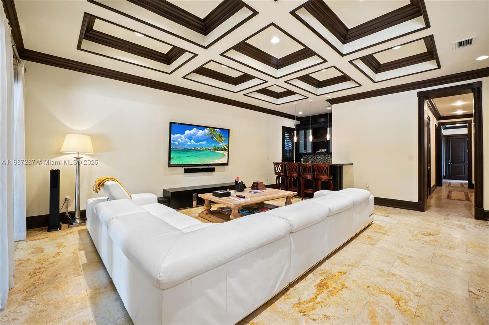 9601 Southwest 60th Court Pinecrest, FL 33156 - Photo 10 of 61 a living room with furniture and a flat screen tv