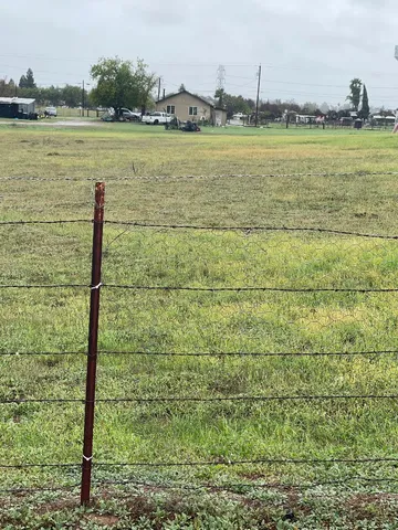 a view of a lake with houses in the background