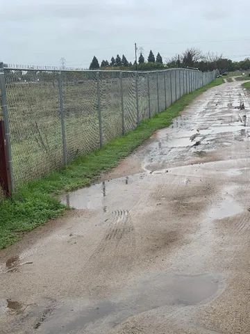 a view of a pathway with a lake