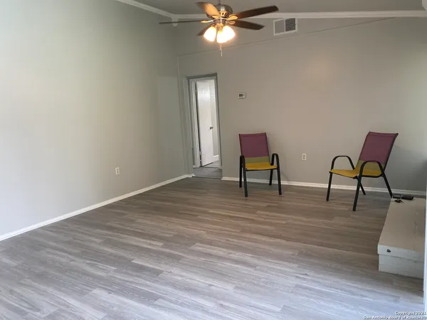 a view of a livingroom with furniture and wooden floor