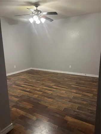a view of an empty room with a fan