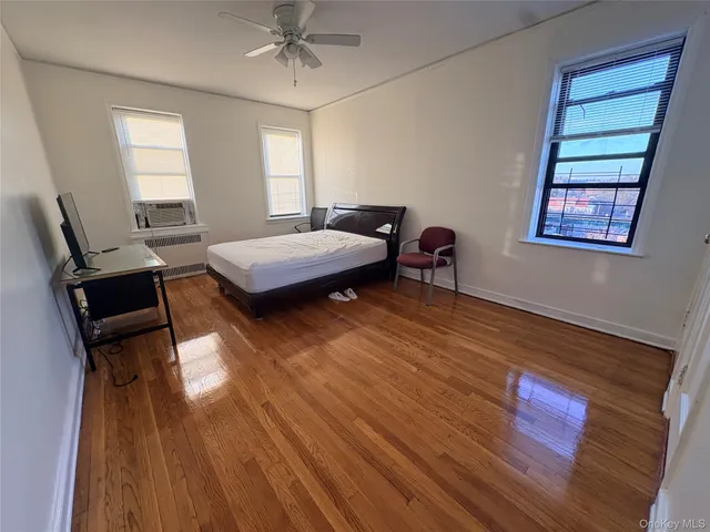 a bedroom with a bed and a desk