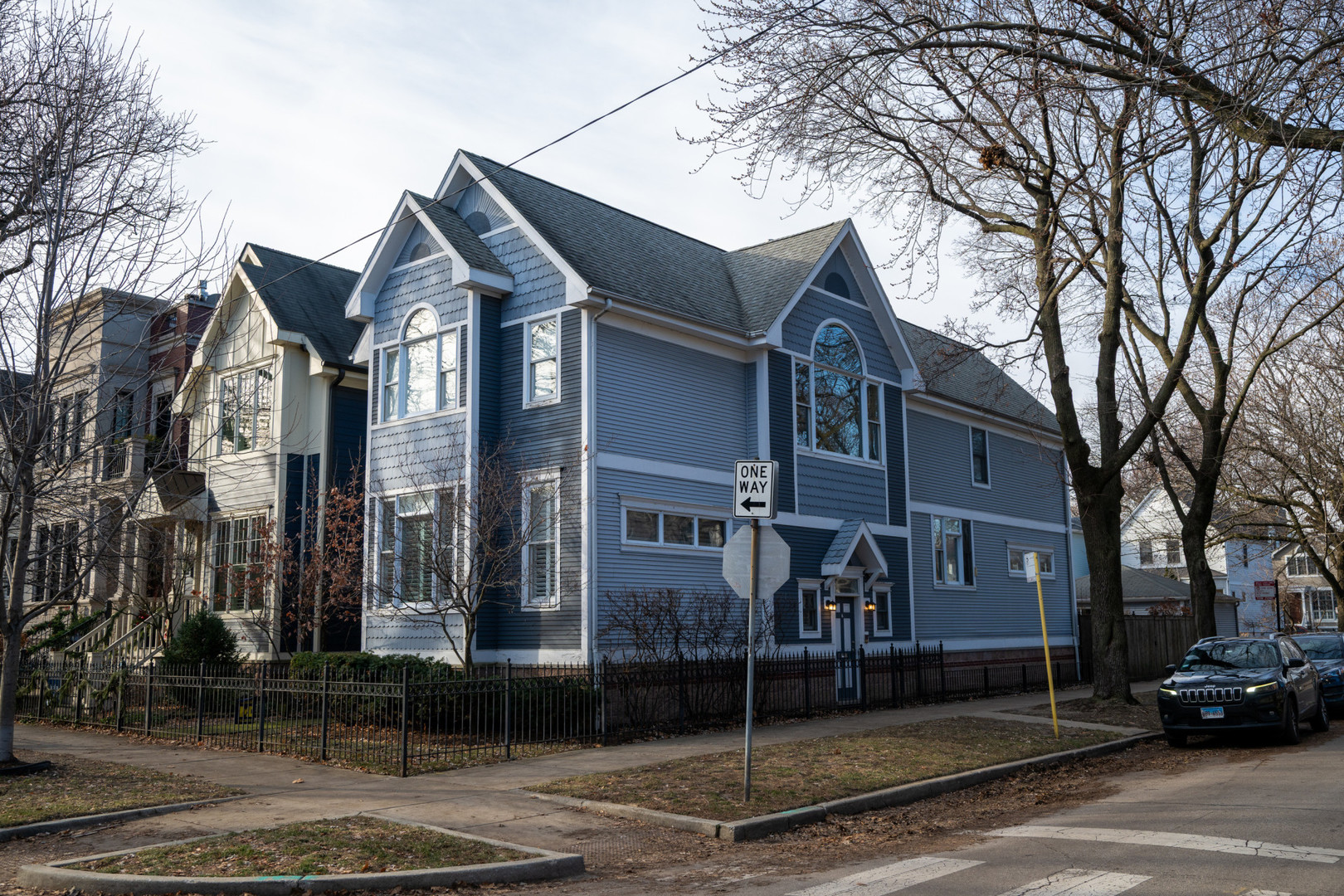 a front view of a residential apartment building with a yard