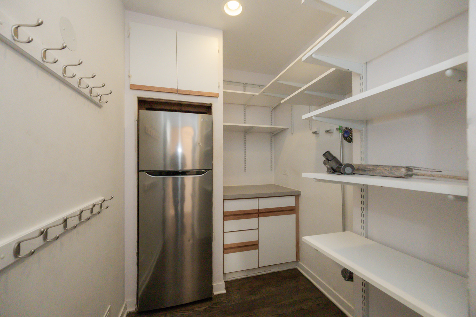 1701 West Byron Street Chicago, IL 60613 - Photo 16 of 57 a kitchen with a refrigerator and cabinets