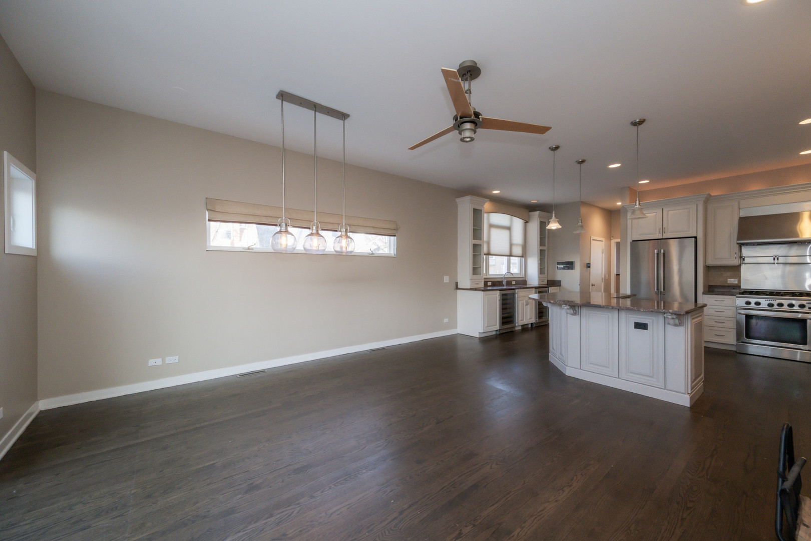 1701 West Byron Street Chicago, IL 60613 - Photo 20 of 57 a view of a kitchen with furniture and wooden floor