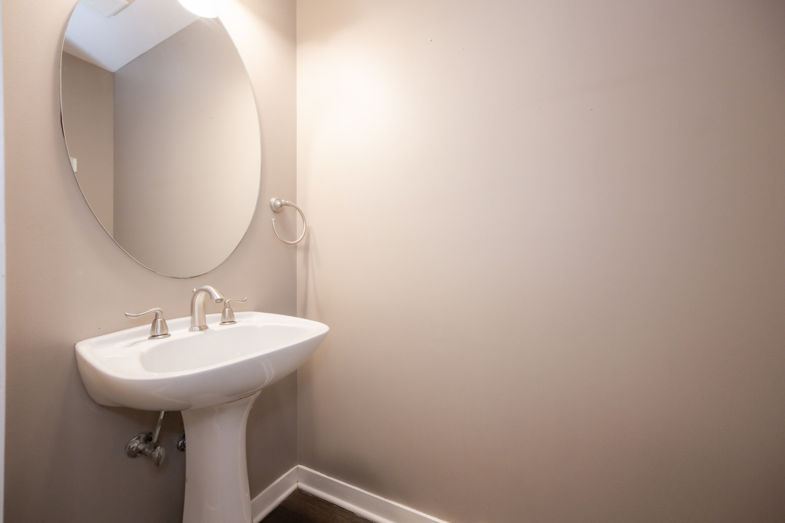 1701 West Byron Street Chicago, IL 60613 - Photo 23 of 57 a bathroom with a sink and mirror
