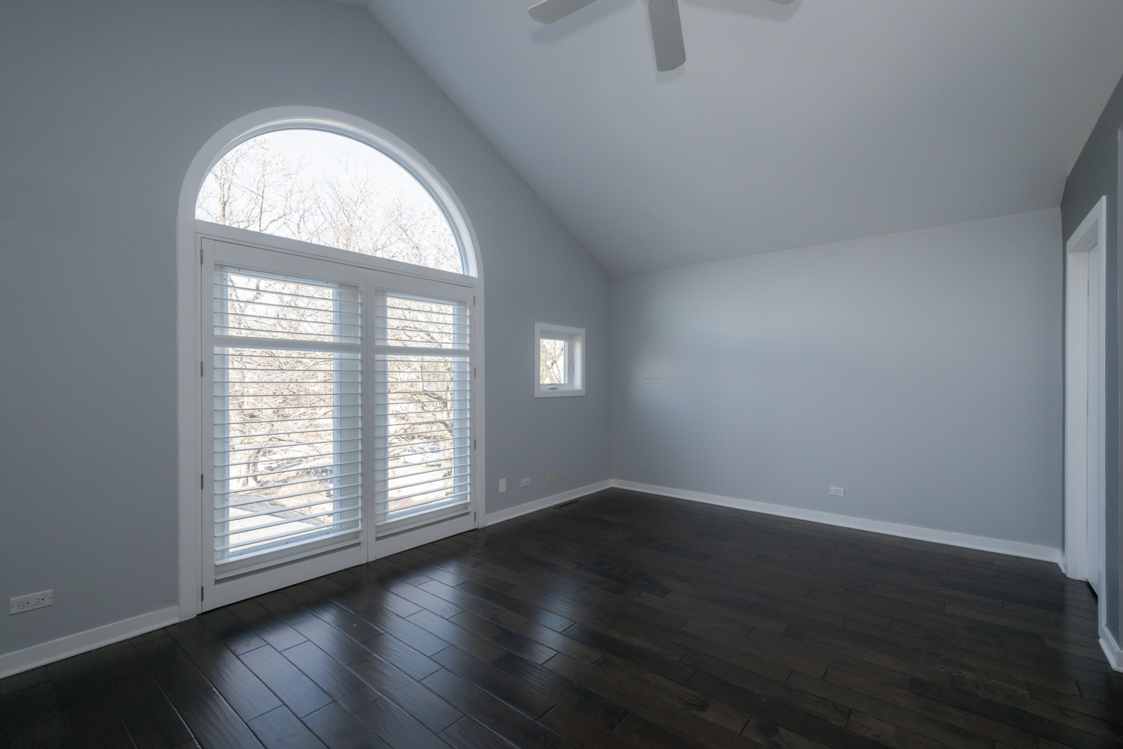 1701 West Byron Street Chicago, IL 60613 - Photo 24 of 57 an empty room with wooden floor and windows