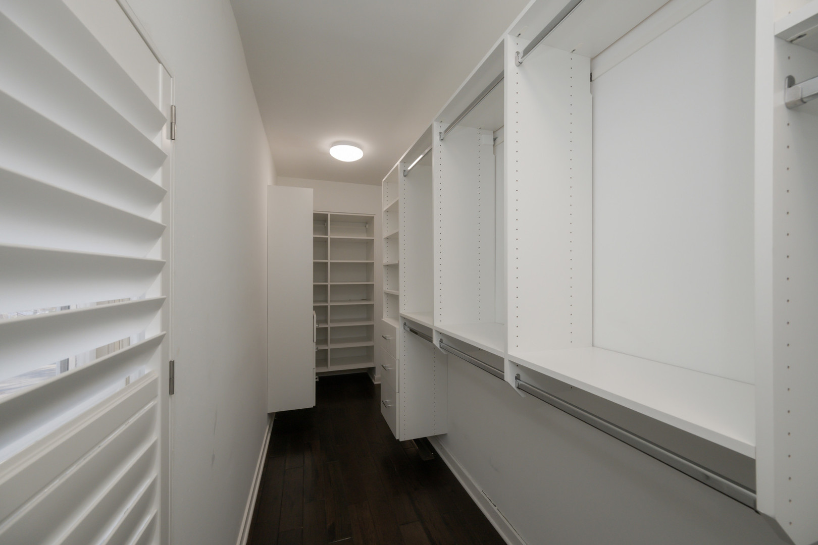 1701 West Byron Street Chicago, IL 60613 - Photo 27 of 57 a view of walk in closet with empty racks