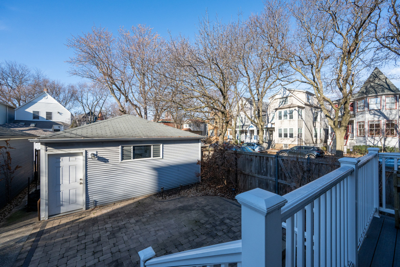 1701 West Byron Street Chicago, IL 60613 - Photo 53 of 57 a front view of house with yard and trees in the background
