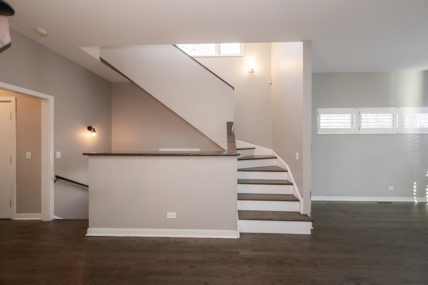 1701 West Byron Street Chicago, IL 60613 - Photo 9 of 57 a view of entryway with stairs and wooden floor