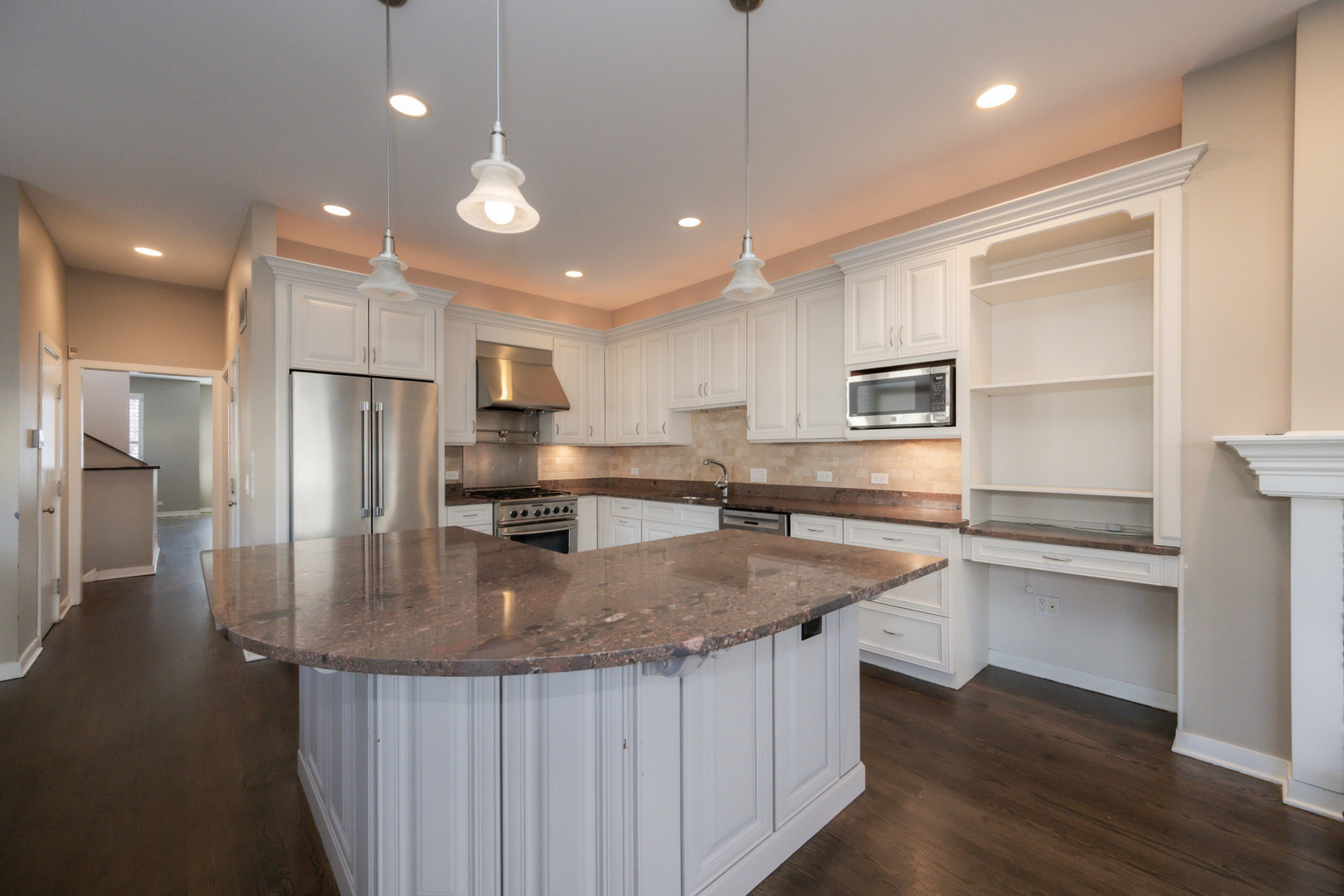 1701 West Byron Street Chicago, IL 60613 - Photo 10 of 57 a kitchen with stainless steel appliances granite countertop a sink refrigerator and cabinets