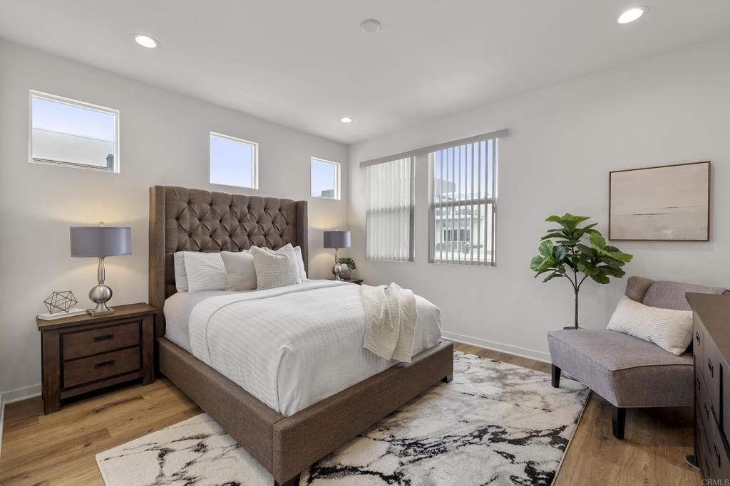 2026 Tango Loop, Unit 3 Chula Vista, CA 91915 - Photo 13 of 34 a bedroom with a bed and a couch