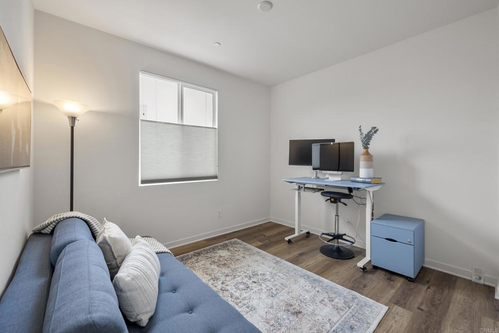 2026 Tango Loop, Unit 3 Chula Vista, CA 91915 - Photo 14 of 34 a living room with furniture and a flat screen tv
