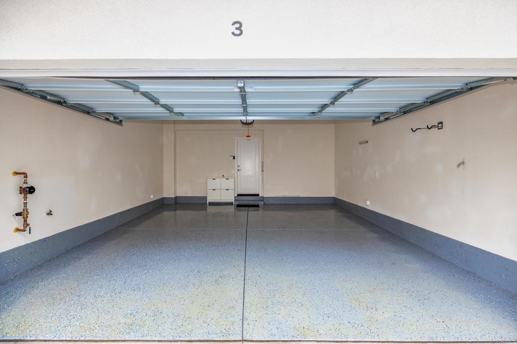 2026 Tango Loop, Unit 3 Chula Vista, CA 91915 - Photo 33 of 34 a view of a room with racks on the wall