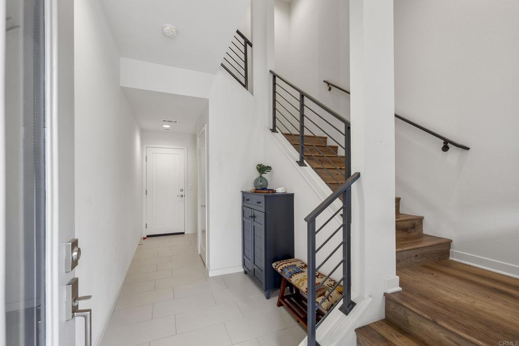 2026 Tango Loop, Unit 3 Chula Vista, CA 91915 - Photo 34 of 34 a view of a livingroom with wooden floor and stairs